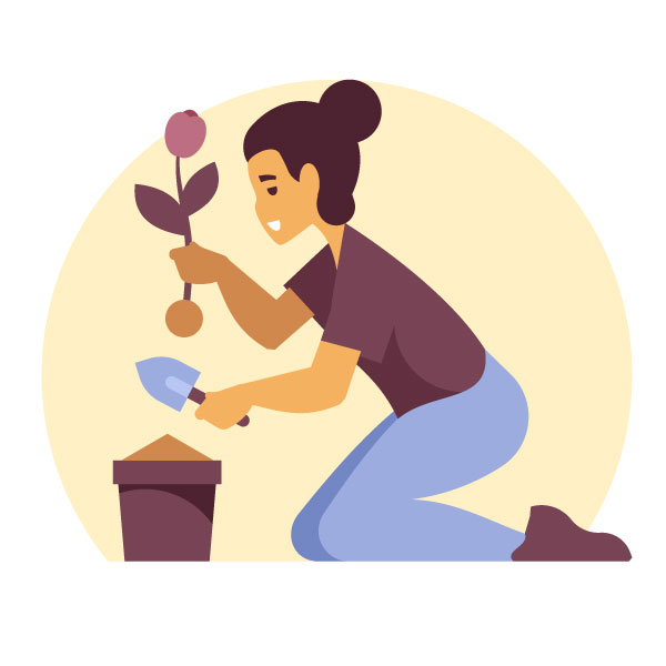 Mujer plantando una flor
