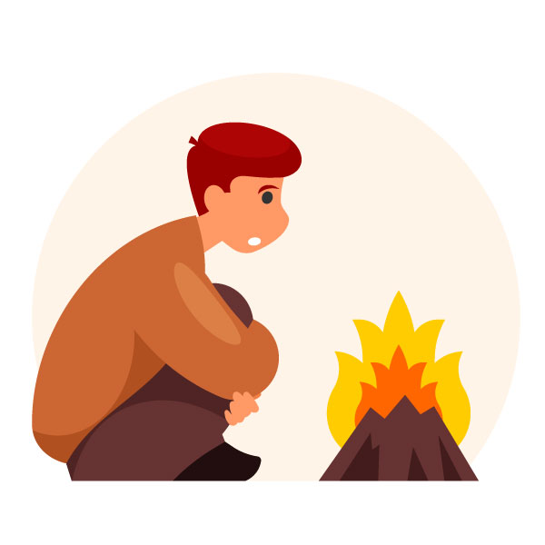 Un hombre se calienta junto al fuego